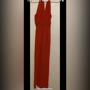 pompous girly Red jumpsuit with gold chain at neck size small